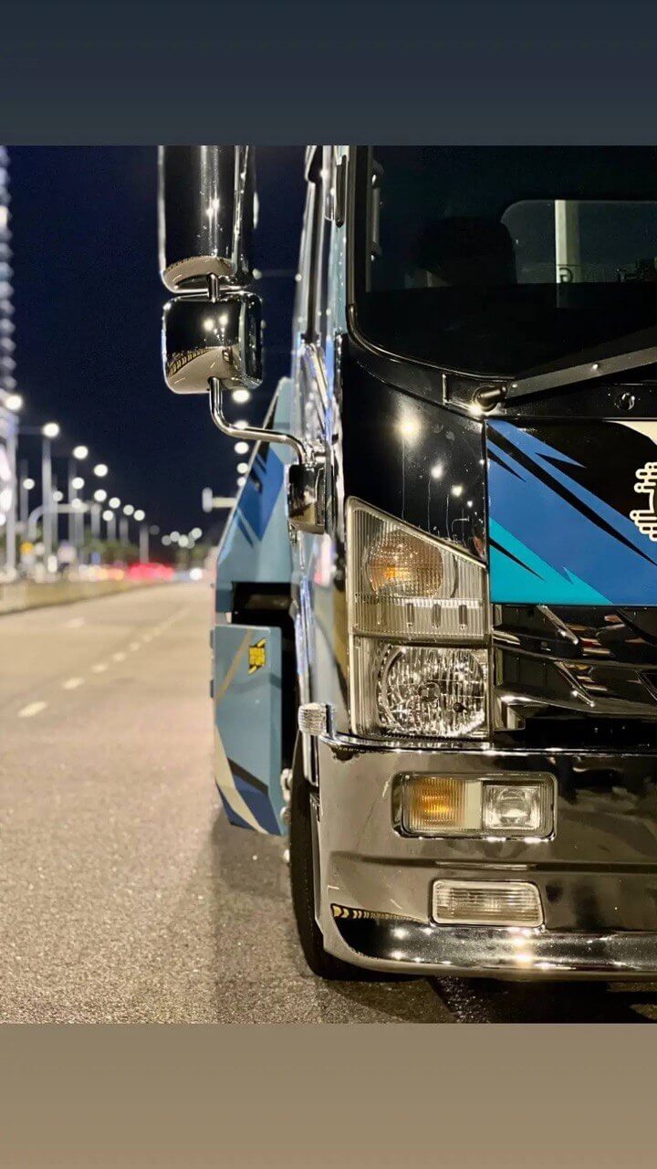 Close-up of a 47 Towing vehicle at night